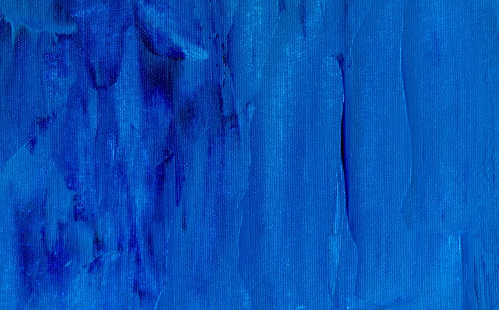 Abstract blue textured brushwork used as a decorative background